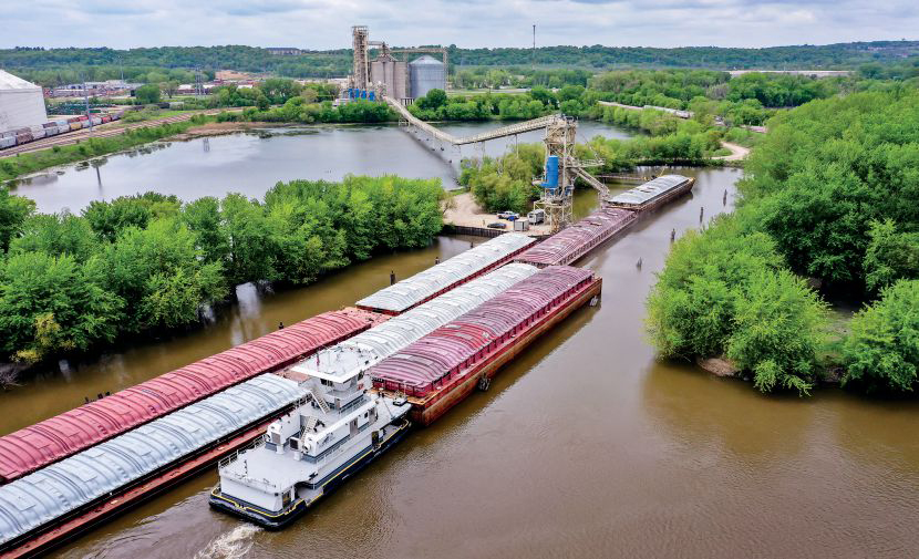 Towboat pushing a barge in port. 