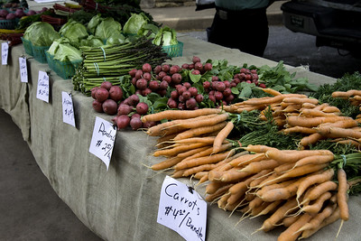 Photo of carrots, radishes, asparagus on a table