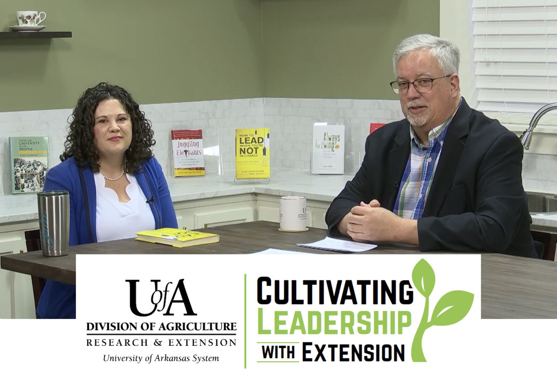 Cultivating Leadership with Extension Two people sitting at table