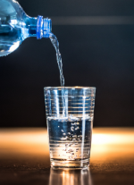 Picture of glass being filled by water bottle