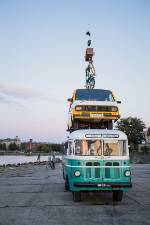 Bus carrying a car and bicycle 