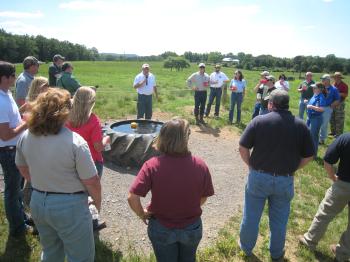 Speaker discussing alternative livestock watering trough in Arkansas.
