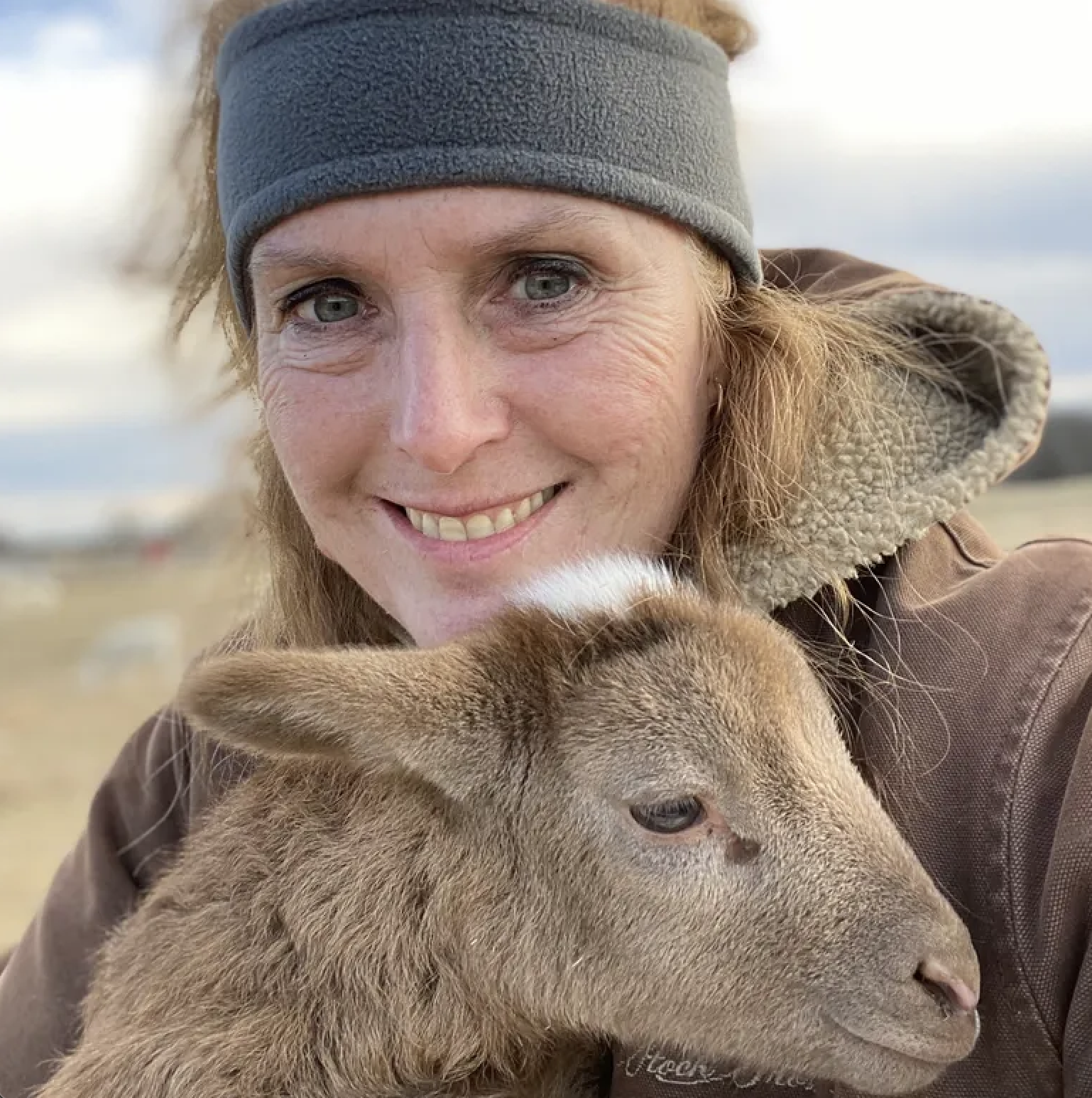 Marti Carlson holding a lamb