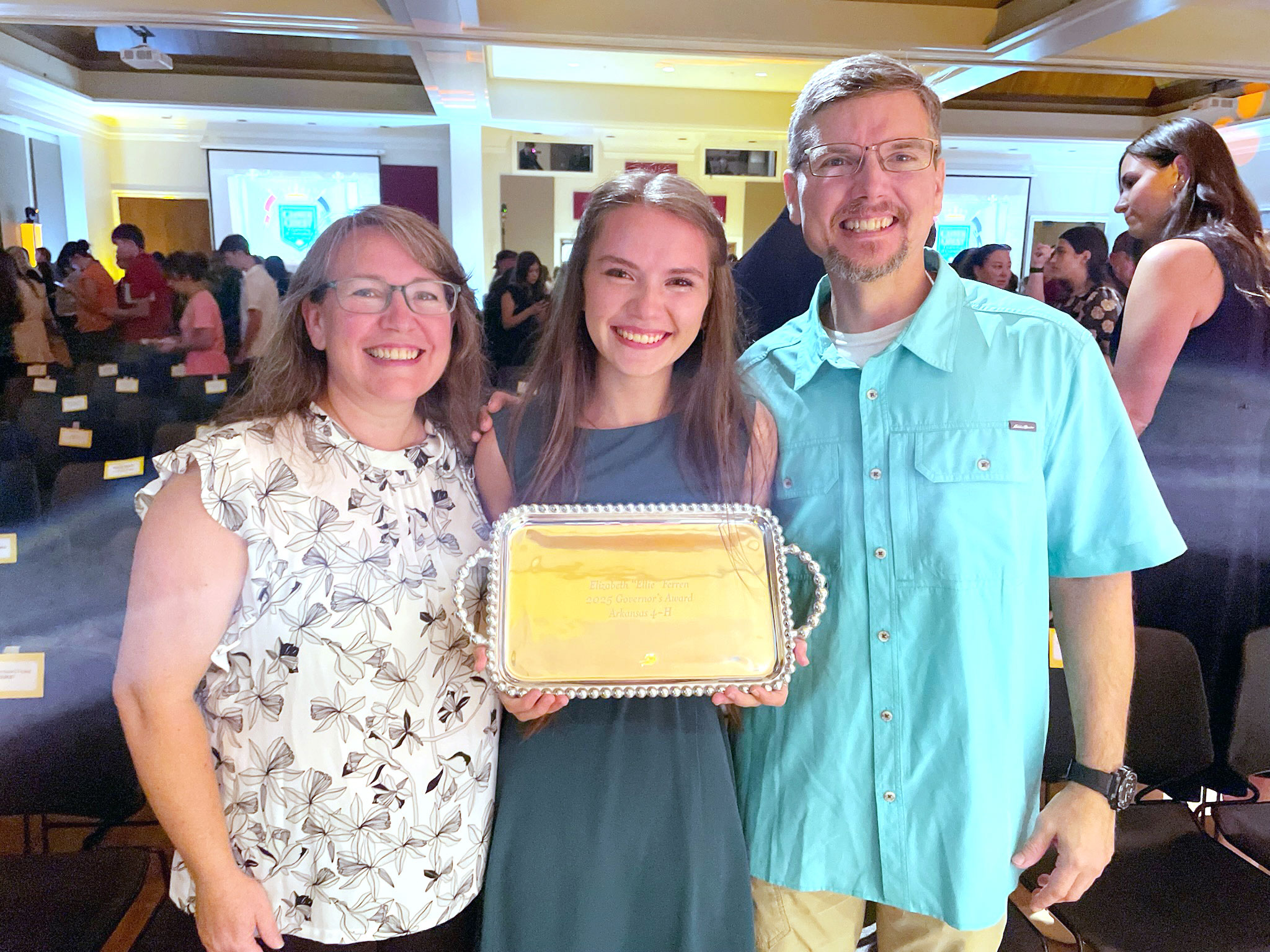 Ellie Ferren poses with her parents