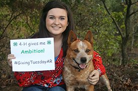 4-H'er displaying what 4-H has given her ambition