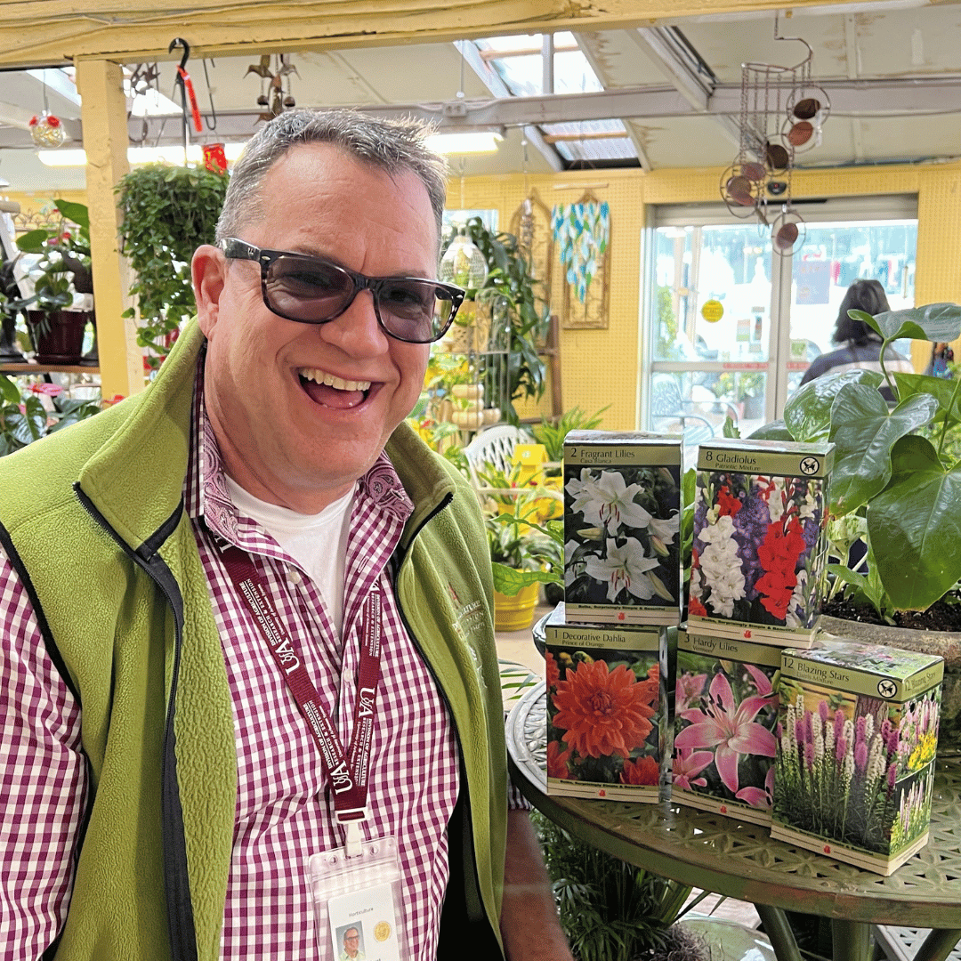 Randy Forst posing in a garden center