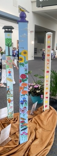 photo of a colorfully decorated spirit pole